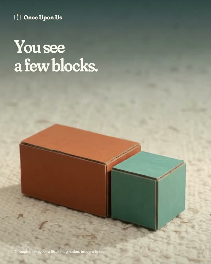 Toy blocks become a train crossing a bridge through folded mountains.