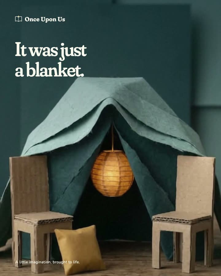 A blanket fort opens into a lantern-lit forest.